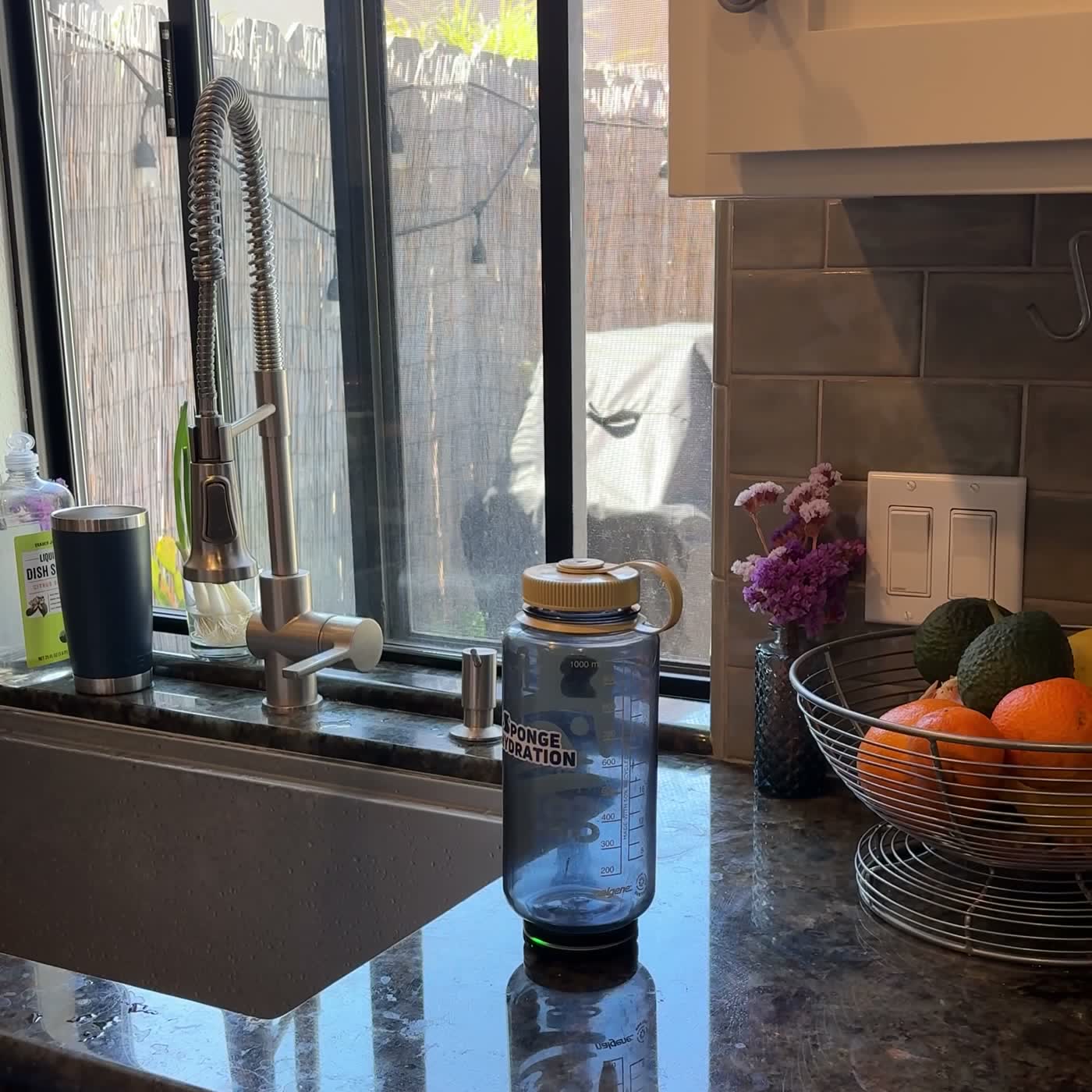 Sponge tracker on a water bottle at a desk